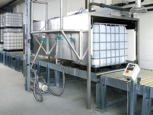 Pallet conveyor system for handling of pallet containers with liquids at Coloplast in Denmark.