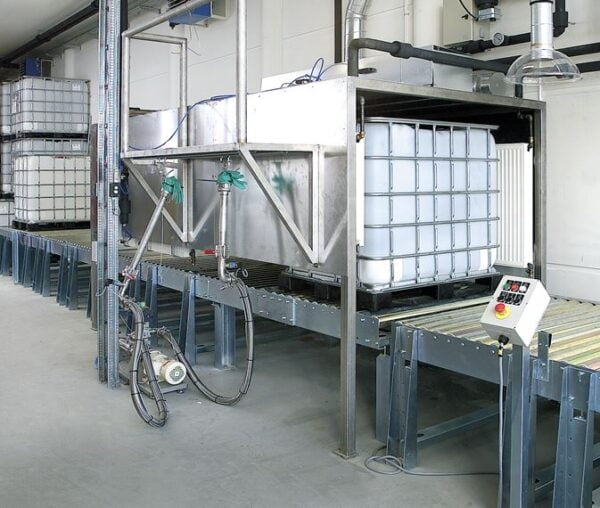 Pallet conveyor system for handling of pallet containers with liquids at Coloplast in Denmark.